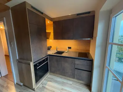 Küche/Küchenzeile in der Unterkunft moderne Apartments am Attersee Dachsteinblick - ruhige Lage mit traumhaften Blick