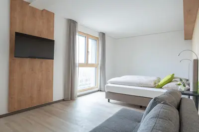 Ein Bett oder Betten in einem Zimmer der Unterkunft eee Hotel Eberstalzell