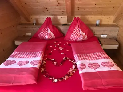 Ein Bett oder Betten in einem Zimmer der Unterkunft Premiumalmhütte Wiedhupf