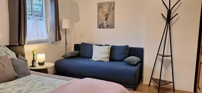 Ein Bett oder Betten in einem Zimmer der Unterkunft Hexenhäuschen