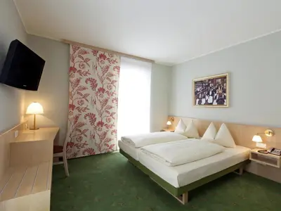 Ein Bett oder Betten in einem Zimmer der Unterkunft Landzeit Tauernalm