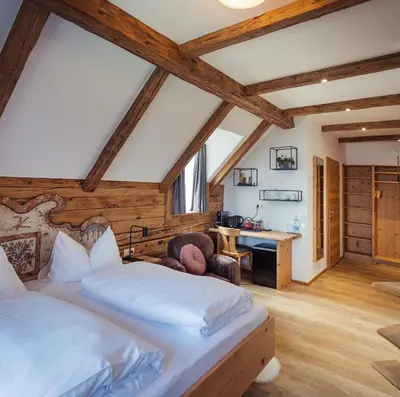 Ein Bett oder Betten in einem Zimmer der Unterkunft Gmundnerberghaus - ROOMS