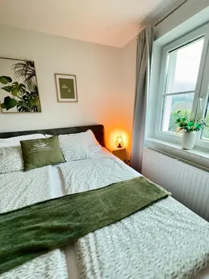 Ein Bett oder Betten in einem Zimmer der Unterkunft Apartment Ferienwohnung DAS UNTERACH am Attersee