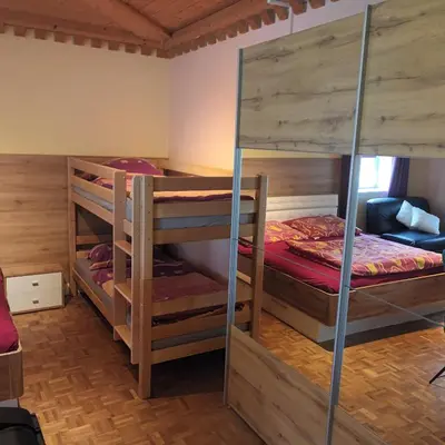 Ein Bett oder Betten in einem Zimmer der Unterkunft Zimmer und Appartement Marktcafe Sankt Peter am Kammersberg 87