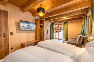Ein Bett oder Betten in einem Zimmer der Unterkunft Poolchalet Dachsteinblick