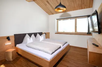 Ein Bett oder Betten in einem Zimmer der Unterkunft Ferienhaus Urlpold