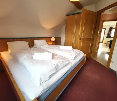 Ein Bett oder Betten in einem Zimmer der Unterkunft Appartements Höller