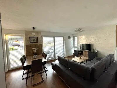 Ein Sitzbereich in der Unterkunft Alpin Apartments