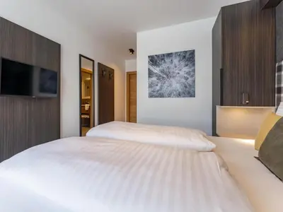 Ein Bett oder Betten in einem Zimmer der Unterkunft Alpenchalet Lambert