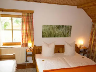 Ein Bett oder Betten in einem Zimmer der Unterkunft Ferienwohnungen Schartner