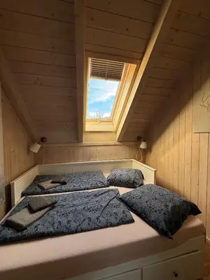 Ein Bett oder Betten in einem Zimmer der Unterkunft Kreischberg Chalet Ferienpark 3