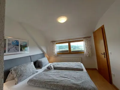 Ein Bett oder Betten in einem Zimmer der Unterkunft Moser Jaggeihof
