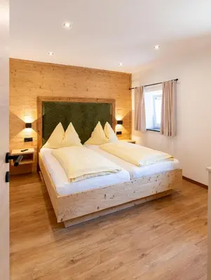 Ein Bett oder Betten in einem Zimmer der Unterkunft Gästehaus Kasbichler
