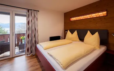 Ein Bett oder Betten in einem Zimmer der Unterkunft Gästehaus Kasbichler