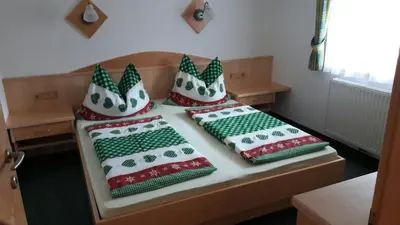 Ein Bett oder Betten in einem Zimmer der Unterkunft Urlaub am Bauernhof Rothof