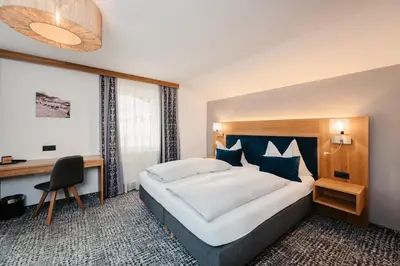 Ein Bett oder Betten in einem Zimmer der Unterkunft Hotel Schützenhof