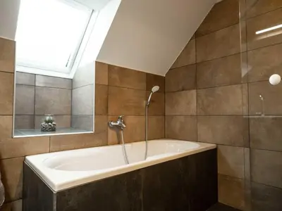 Ein Badezimmer in der Unterkunft Modern apartment right next to the ski lift