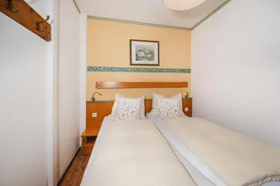 Ein Bett oder Betten in einem Zimmer der Unterkunft Ferienwohnungen Rupertihaus