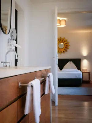 Ein Bett oder Betten in einem Zimmer der Unterkunft Hubertus Boutiquehotel Filzmoos