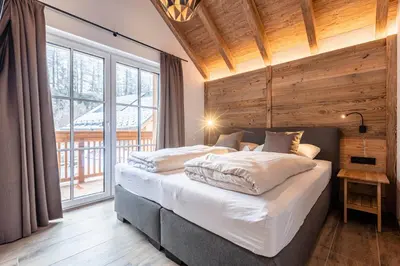 Ein Bett oder Betten in einem Zimmer der Unterkunft AlpiNest Feriendorf Lungau