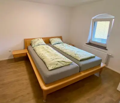 Ein Bett oder Betten in einem Zimmer der Unterkunft Ferienwohnung in Seenähe!