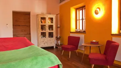 Ein Sitzbereich in der Unterkunft Tauglerei Doppelzimmer Bergamotte