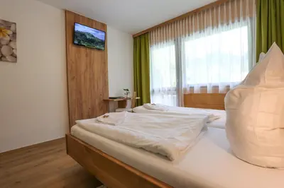 Ein Bett oder Betten in einem Zimmer der Unterkunft Gasthof Leitner - Der Wirt an der Klamm