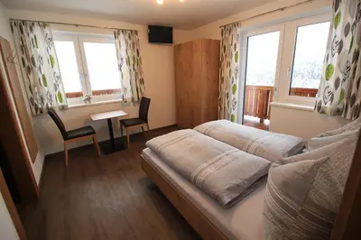 Ein Sitzbereich in der Unterkunft Ferienwohnung Gföller