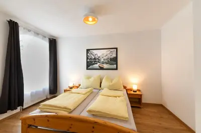 Ein Bett oder Betten in einem Zimmer der Unterkunft Ferienapartments 31erHaus