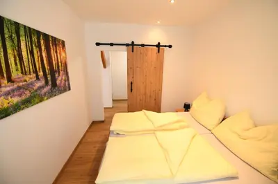 Ein Bett oder Betten in einem Zimmer der Unterkunft Ferienapartments 31erHaus