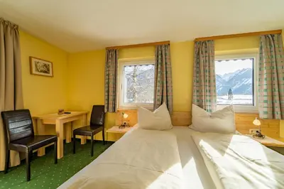 Ein Bett oder Betten in einem Zimmer der Unterkunft Pension Braunhofer