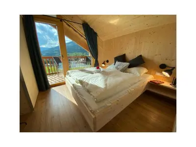 Ein Bett oder Betten in einem Zimmer der Unterkunft Alpenchalét Alpakablick