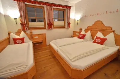 Ein Bett oder Betten in einem Zimmer der Unterkunft Chalet Berghof