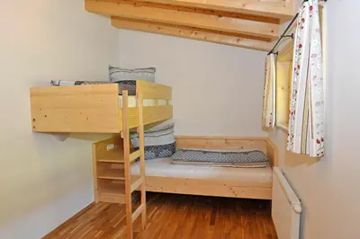 Ein Bett oder Betten in einem Zimmer der Unterkunft Ferienhaus Johanna