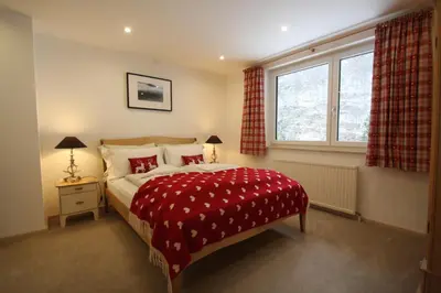 Ein Bett oder Betten in einem Zimmer der Unterkunft Haus Salzkammergut