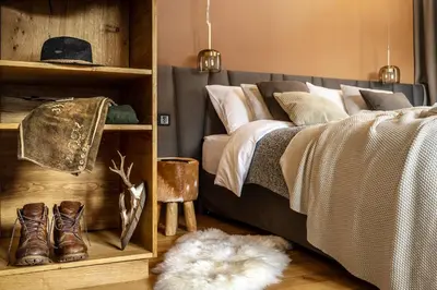 Ein Bett oder Betten in einem Zimmer der Unterkunft Alpin Residenz Dachsteinperle