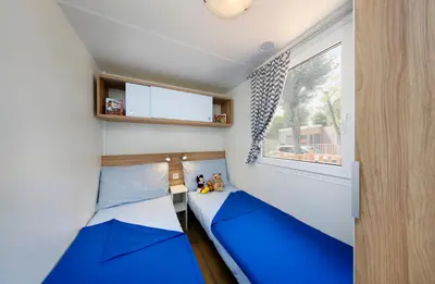 Ein Bett oder Betten in einem Zimmer der Unterkunft Albatross Mobile Homes on Camping Bella Austria