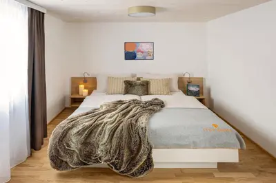 Ein Bett oder Betten in einem Zimmer der Unterkunft MANGGEI-BAU Appartements und Studios
