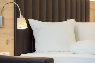 Ein Bett oder Betten in einem Zimmer der Unterkunft Appartement Mühlkogel mit Indoorpool und Sauna