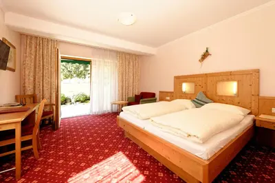 Ein Bett oder Betten in einem Zimmer der Unterkunft Hotel Moser