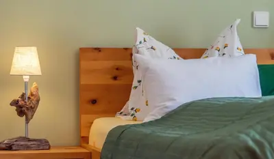 Ein Bett oder Betten in einem Zimmer der Unterkunft Ferienwohnung Leuner