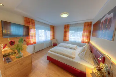 Ein Bett oder Betten in einem Zimmer der Unterkunft Hotel Leimer Bräu