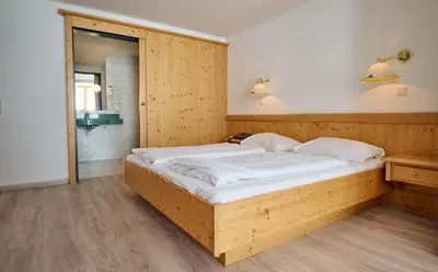 Ein Bett oder Betten in einem Zimmer der Unterkunft Heart Hotel Aurora