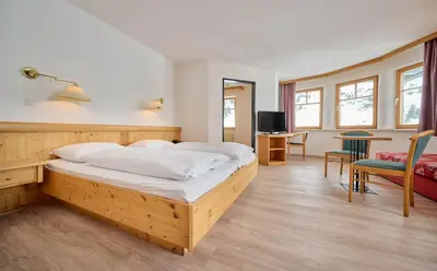 Ein Bett oder Betten in einem Zimmer der Unterkunft Heart Hotel Aurora