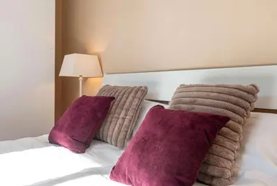 Ein Bett oder Betten in einem Zimmer der Unterkunft Apartments am Kurpark