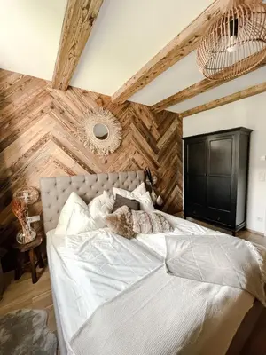 Ein Bett oder Betten in einem Zimmer der Unterkunft Bergzeit by Alpenidyll Apartments