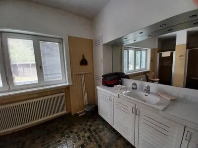 Ein Bett oder Betten in einem Zimmer der Unterkunft Villa Romy mit 3 Gästezimmer