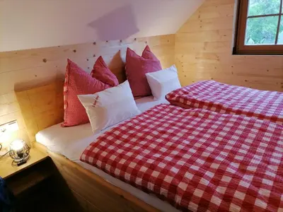 Ein Bett oder Betten in einem Zimmer der Unterkunft Lärchenhaus ,,Unterer Brodl