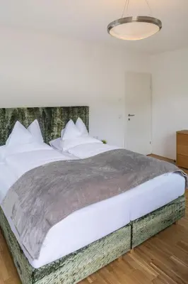 Ein Bett oder Betten in einem Zimmer der Unterkunft Apartment Panoramahirsch