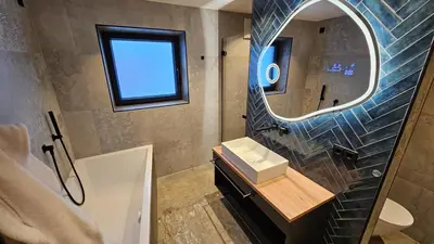 Ein Badezimmer in der Unterkunft Apartment Gosauschmied